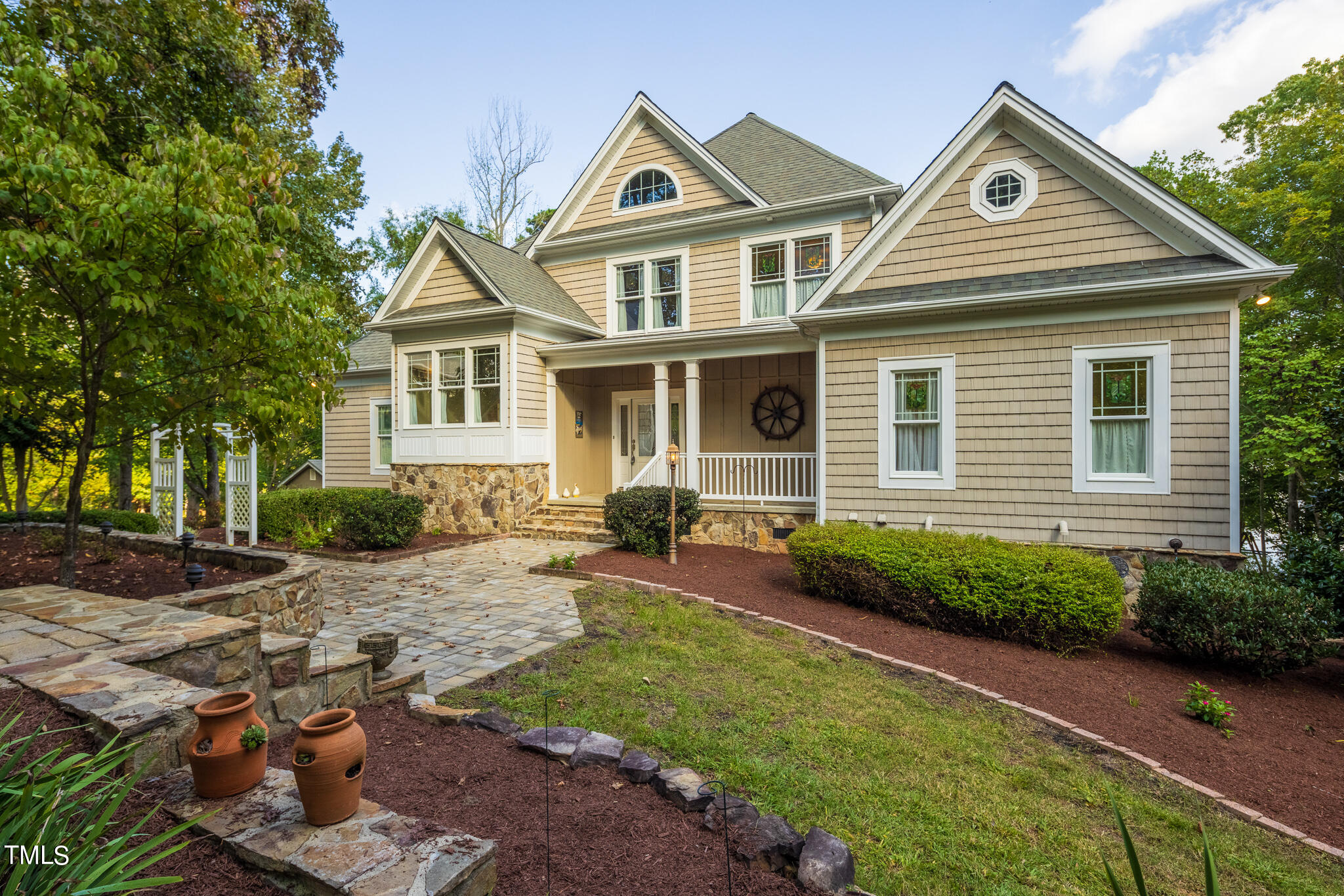 a front view of a house with garden