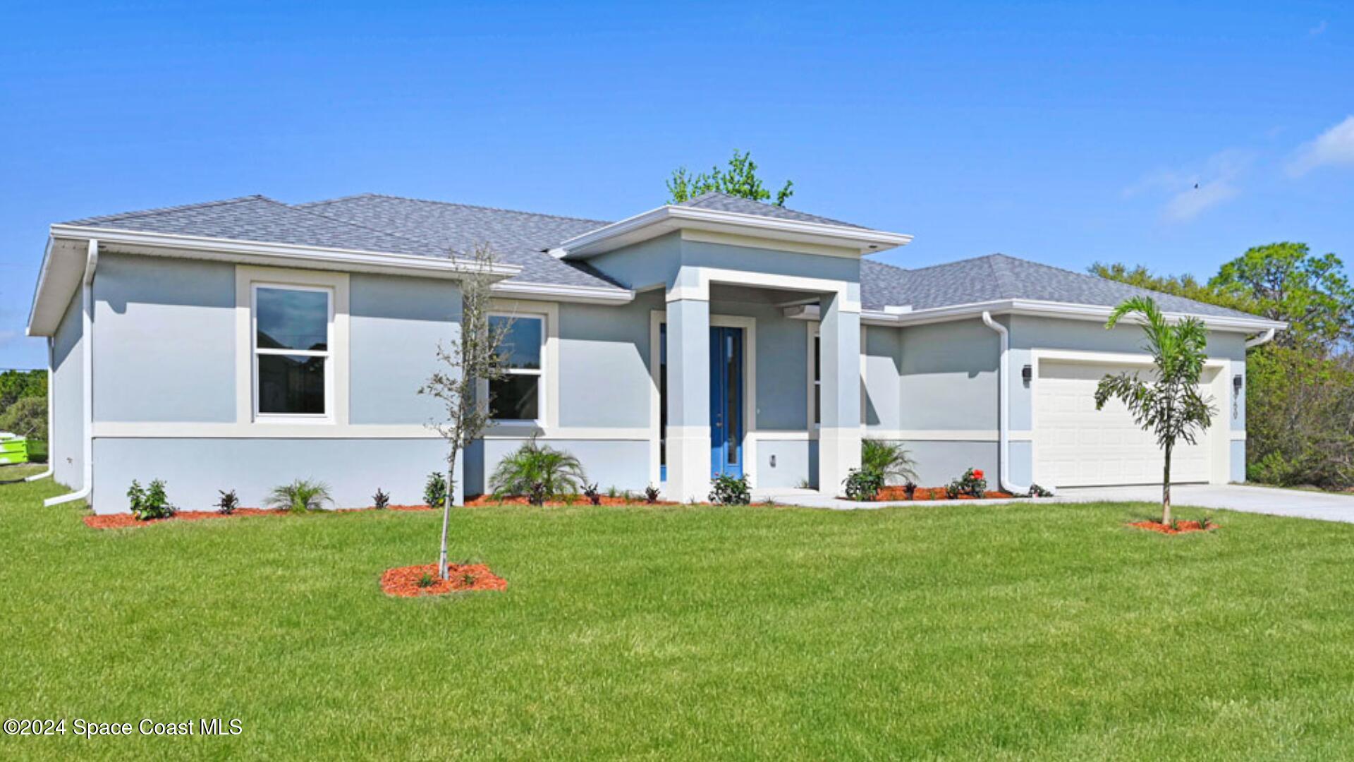 a front view of a house with a yard