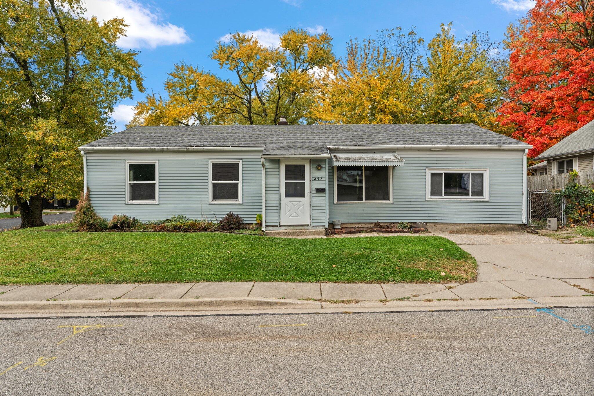 front view of a house with a yard