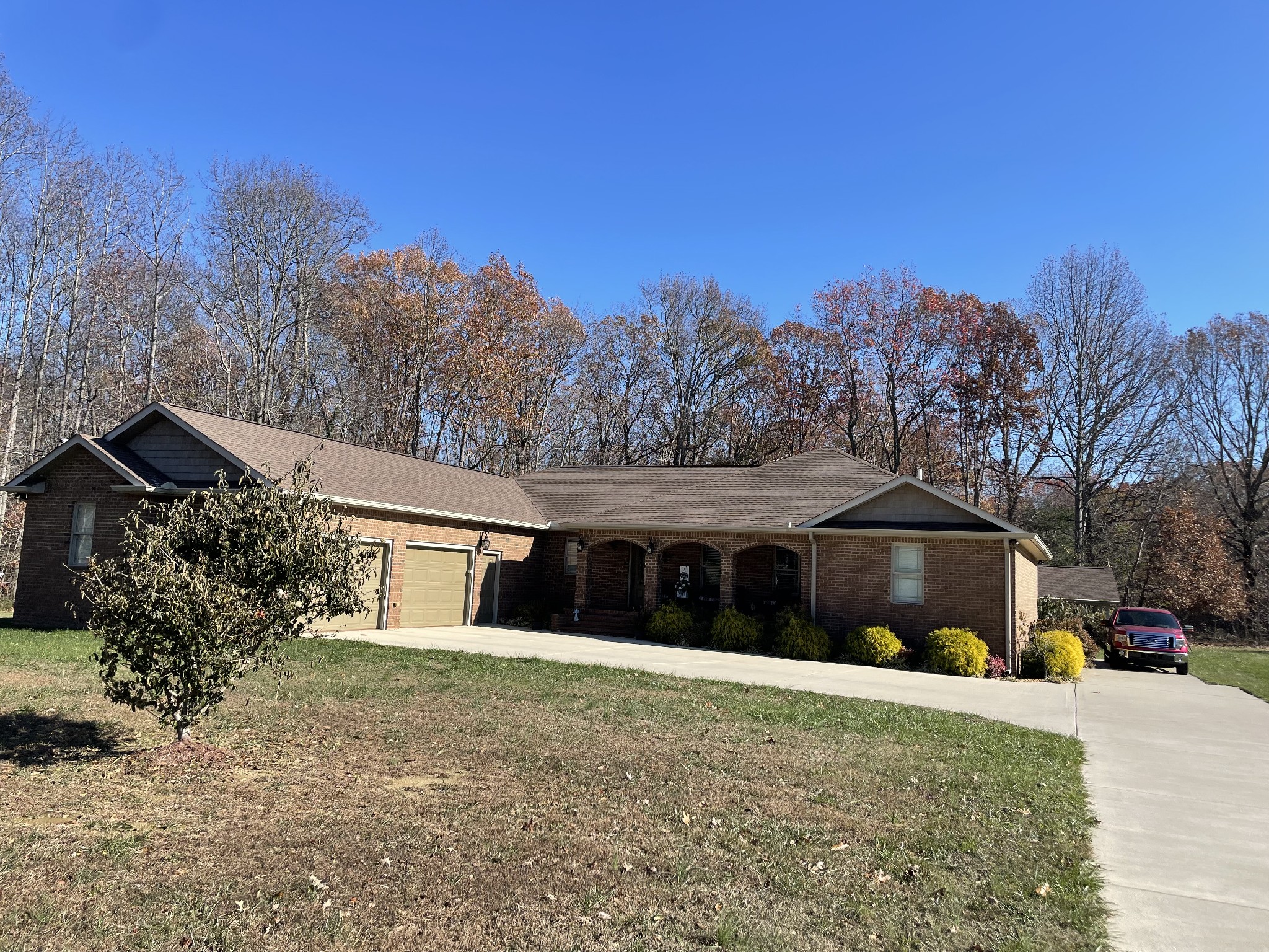 a front view of a house with a yard