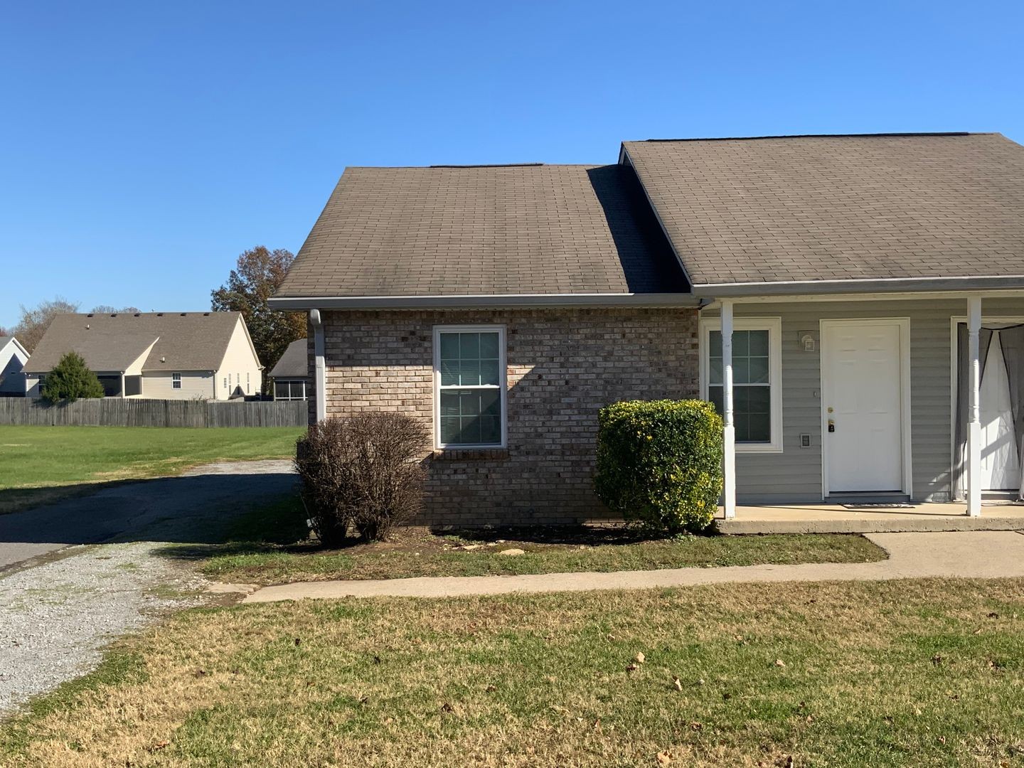 front view of a house with a yard