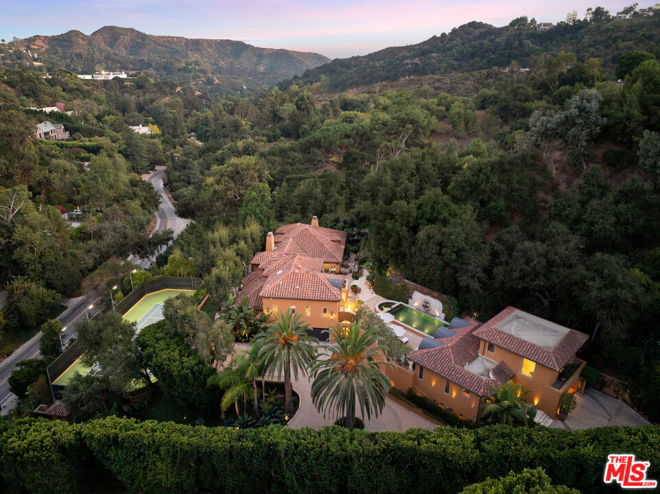 an aerial view of a house with mountain view