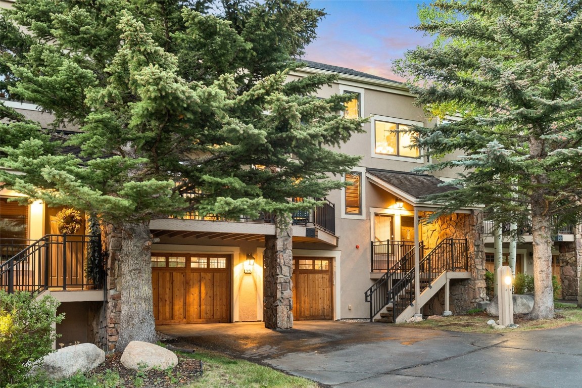 front view of a house with a tree