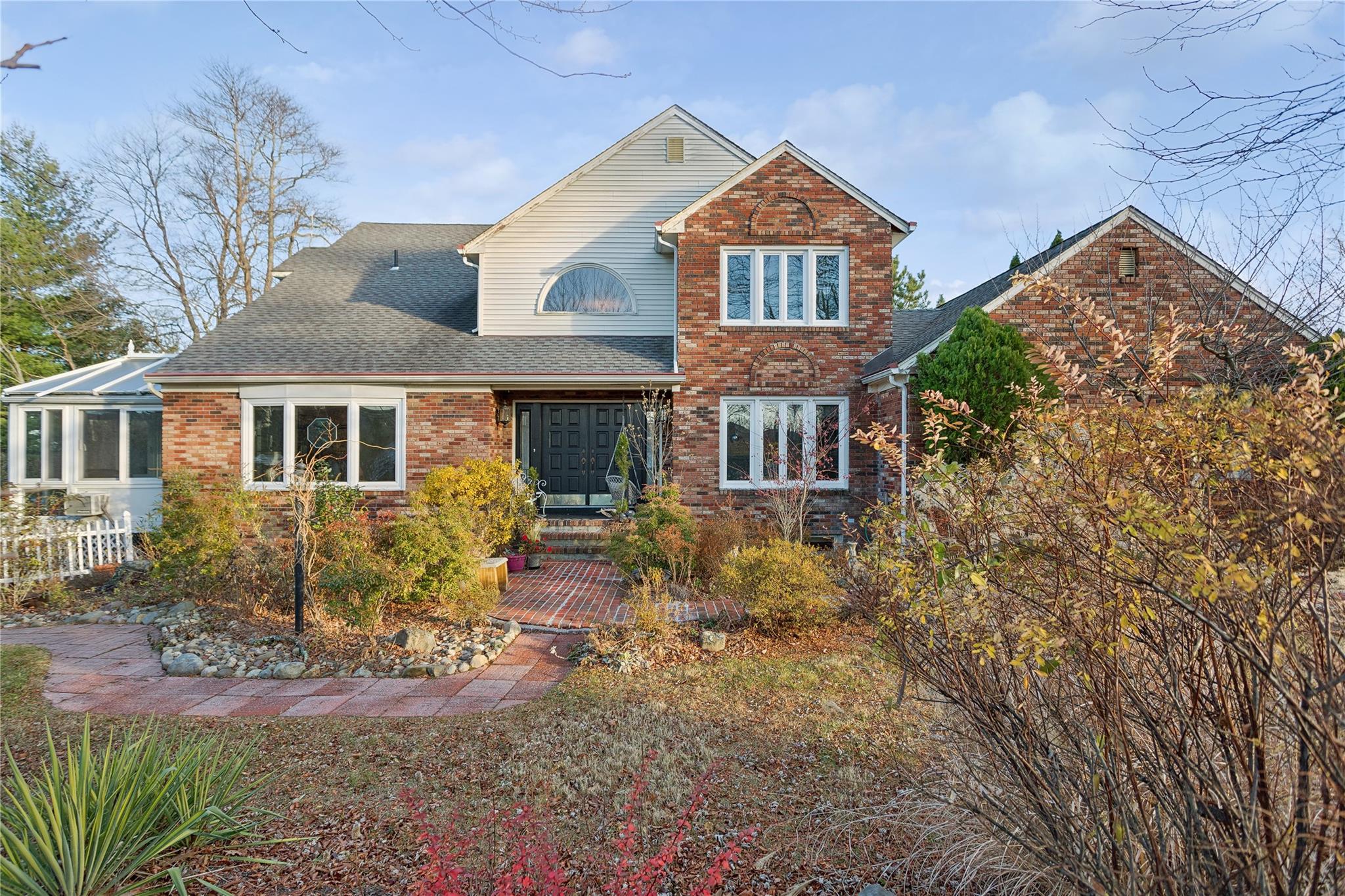 front view of a house with a yard