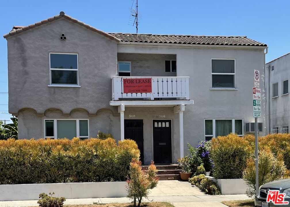 a front view of a house with yard