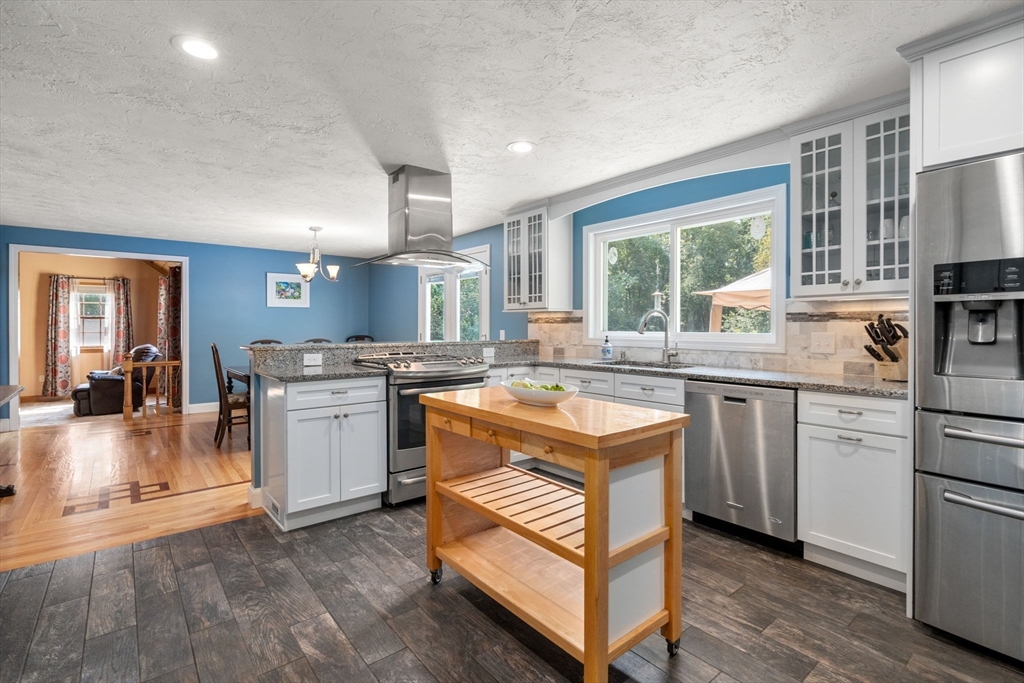 a kitchen with a sink stove and refrigerator