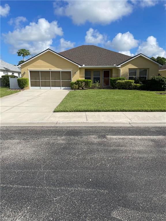 a view of house with yard