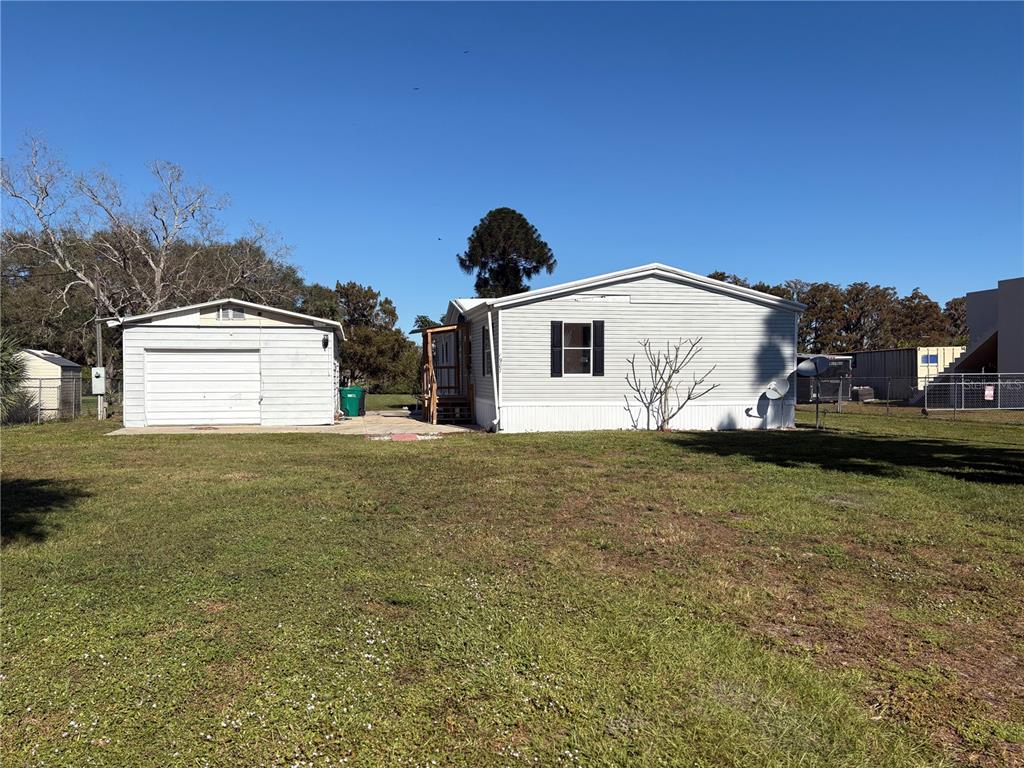 a view of a house with a backyard