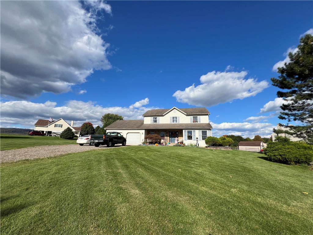 a view of a house with a big yard