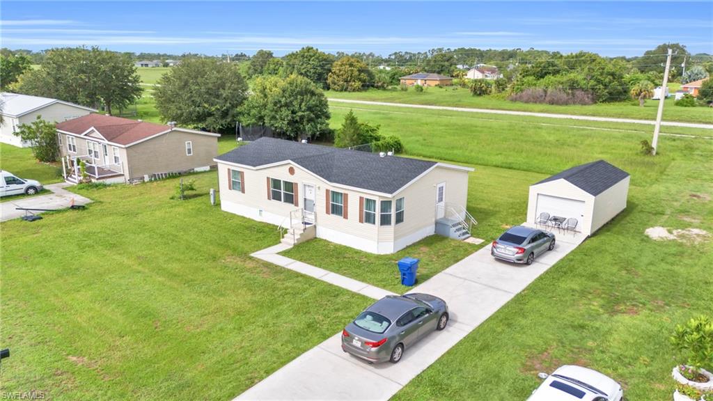 a aerial view of a house with big yard