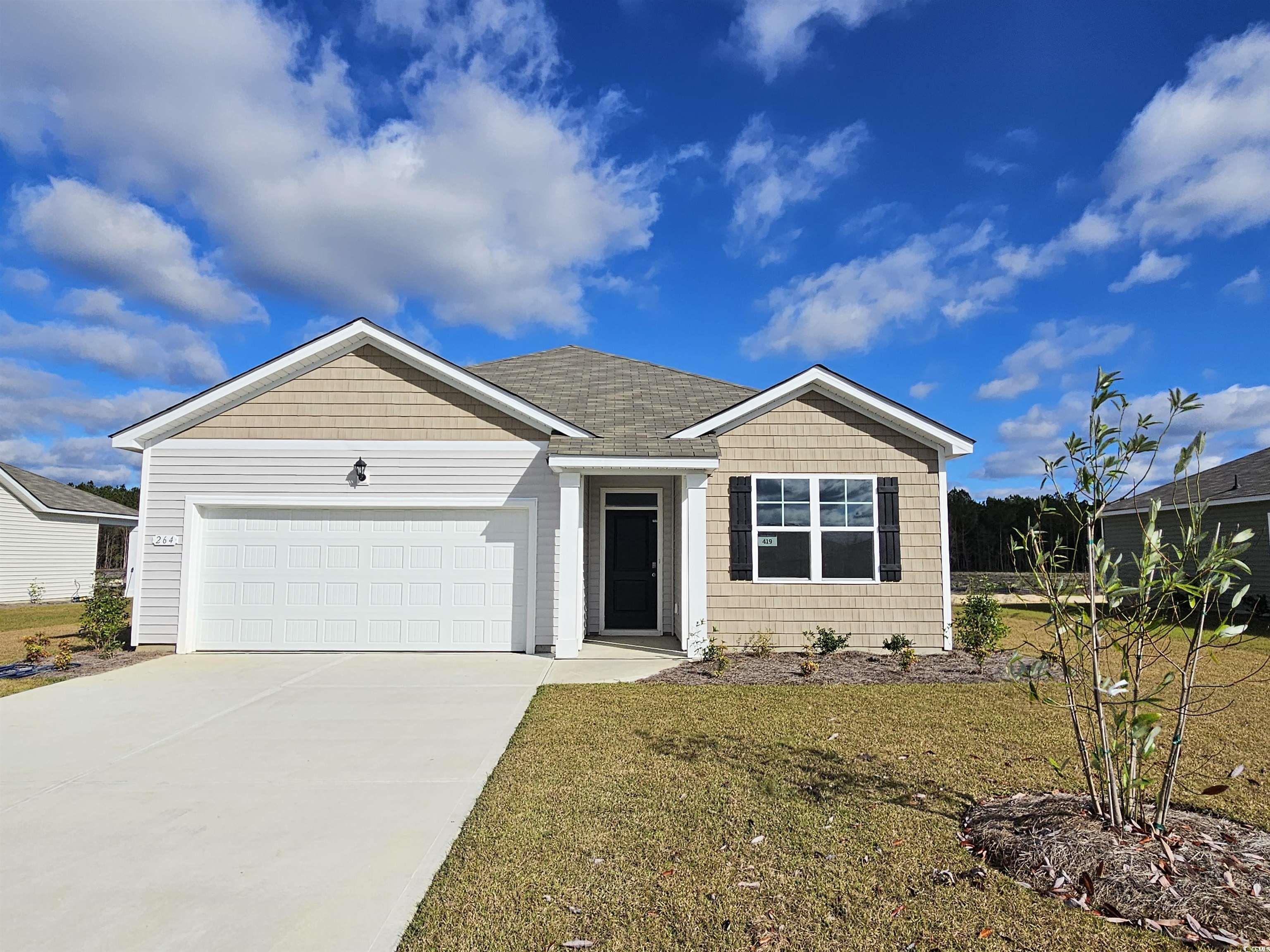 View of front of property with a garage