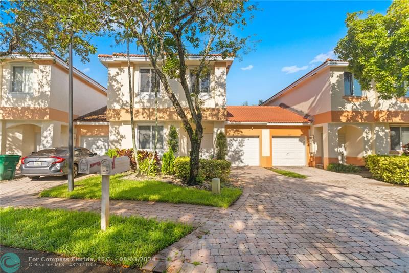 a house view with a garden space