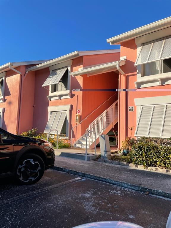 a view of a car park in front of house