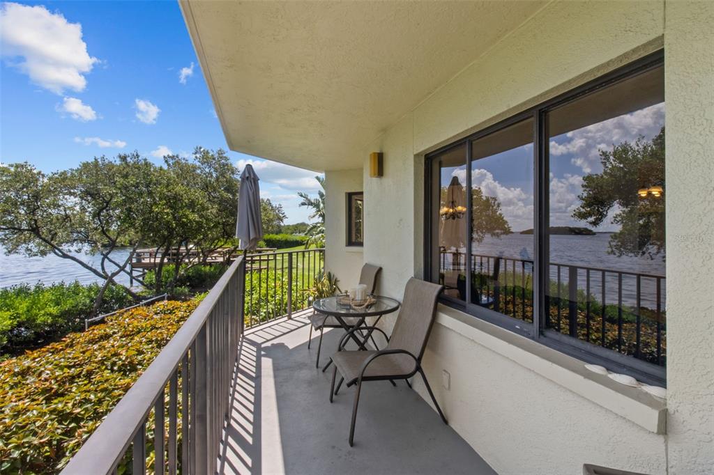 a view of balcony with furniture