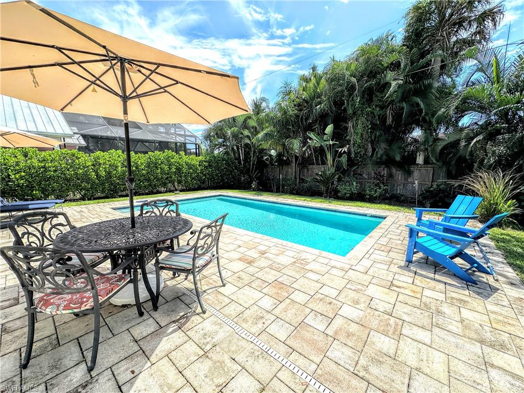 a view of a backyard with a sitting area