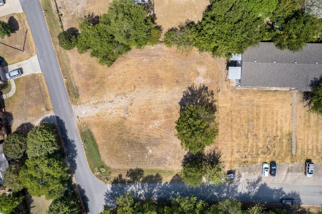 an aerial view of a residential houses with outdoor space