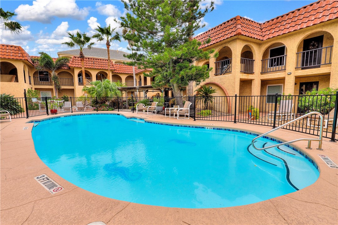 a view of a house with swimming pool