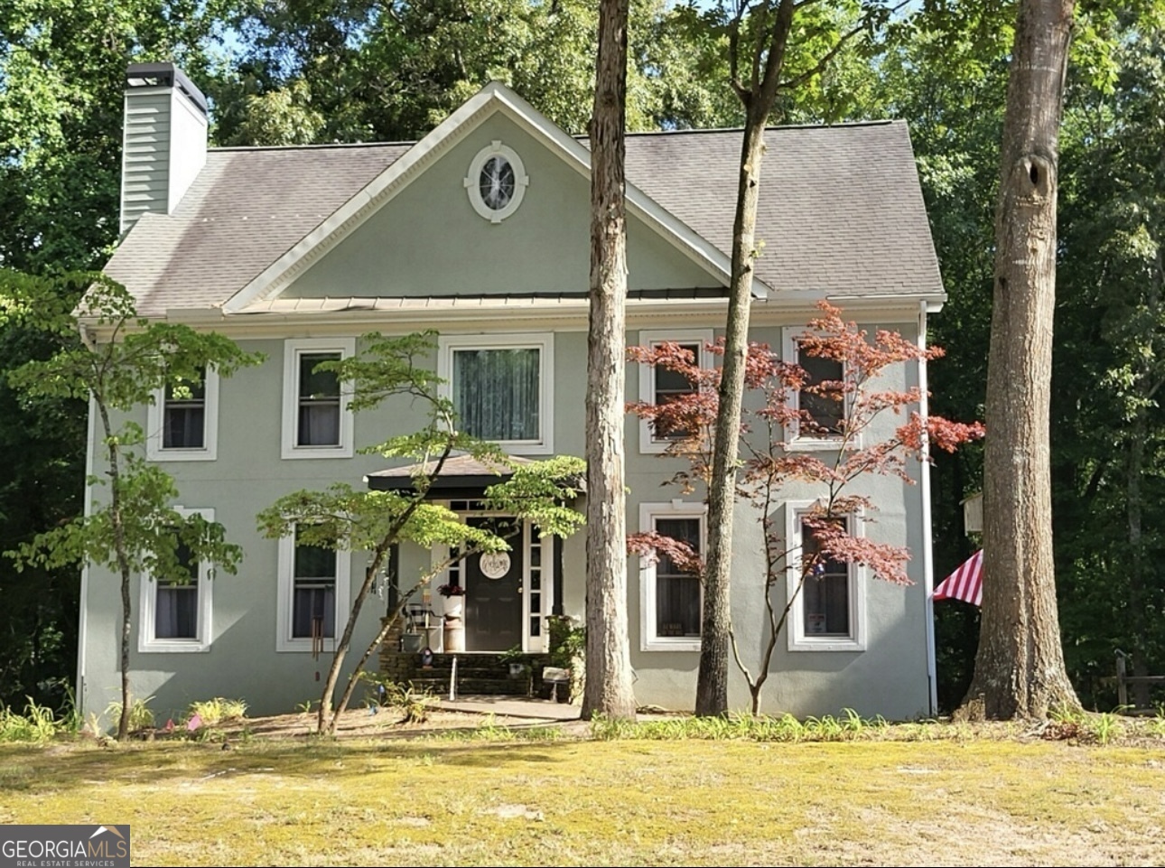 a front view of house with a yard