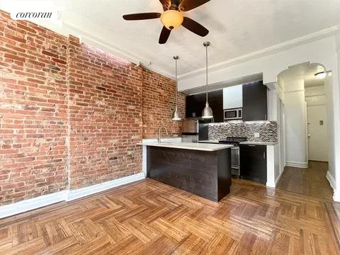 a large kitchen with stainless steel appliances granite countertop a stove and a sink