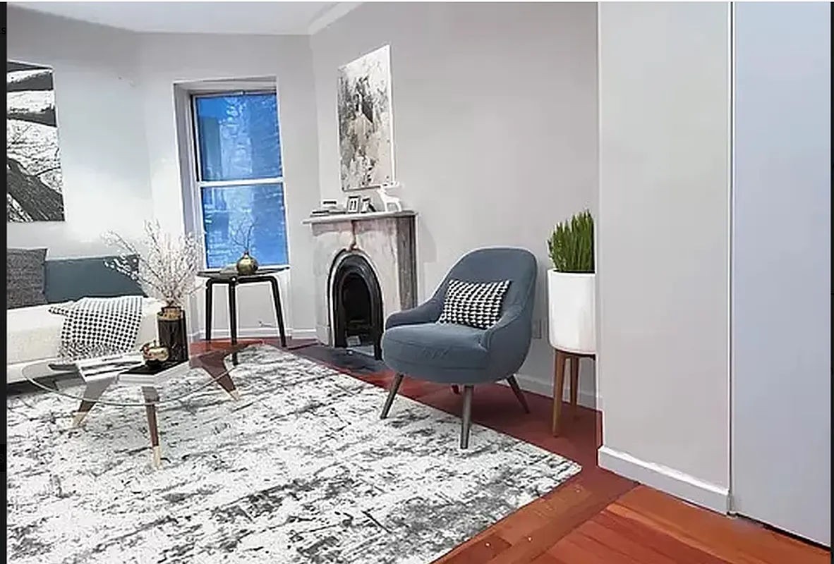 a living room with furniture and a rug