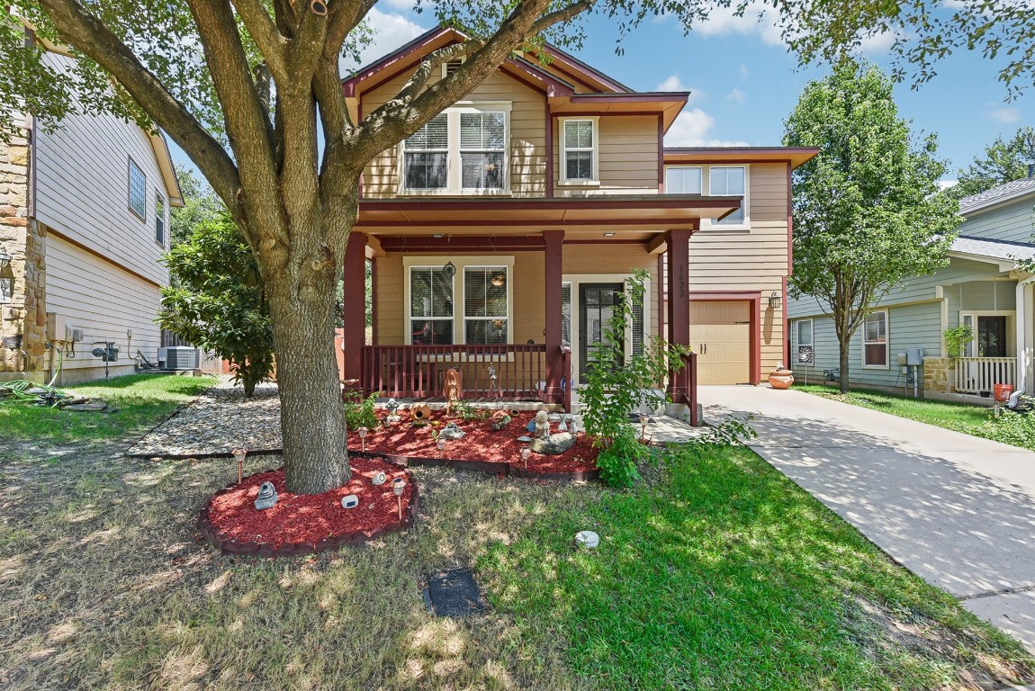 a front view of a house with garden