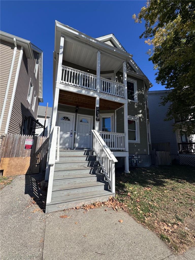 View of front of home featuring a balcony