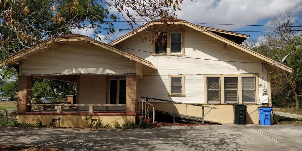 a front view of a house with parking