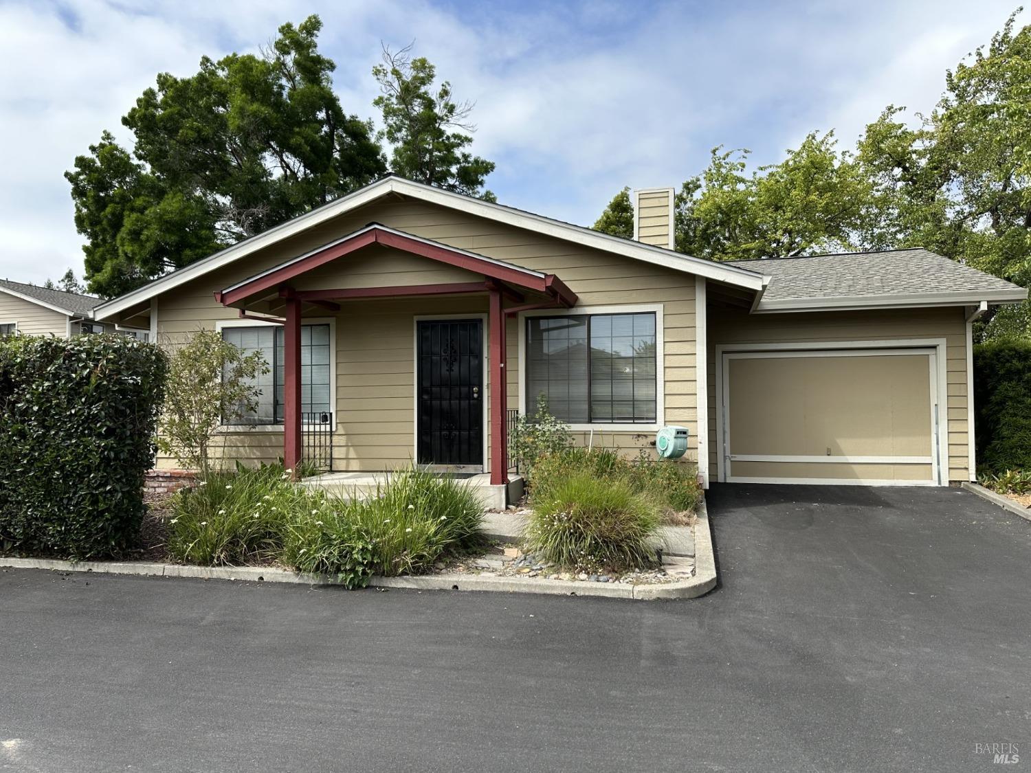 a view of a house with a yard and garage