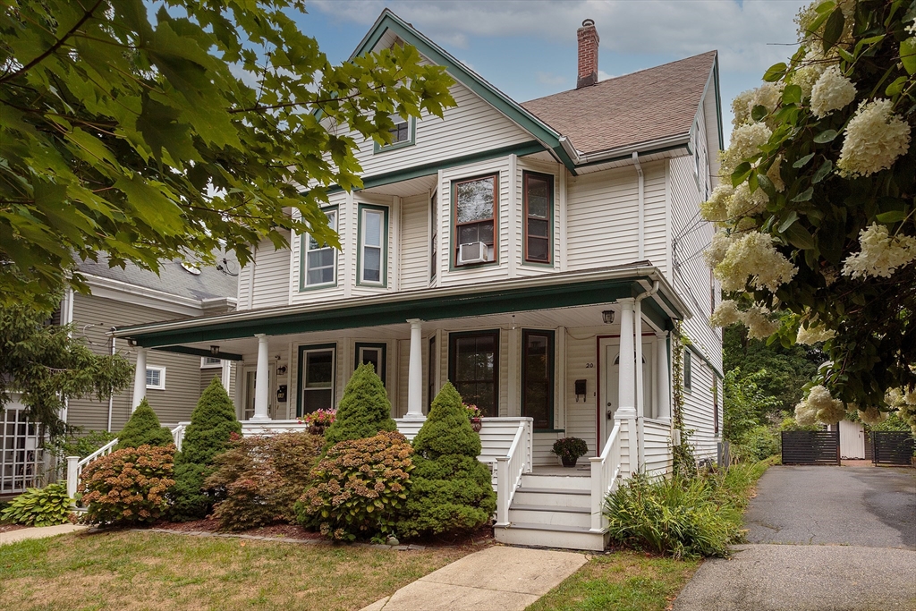 front view of a house with a garden