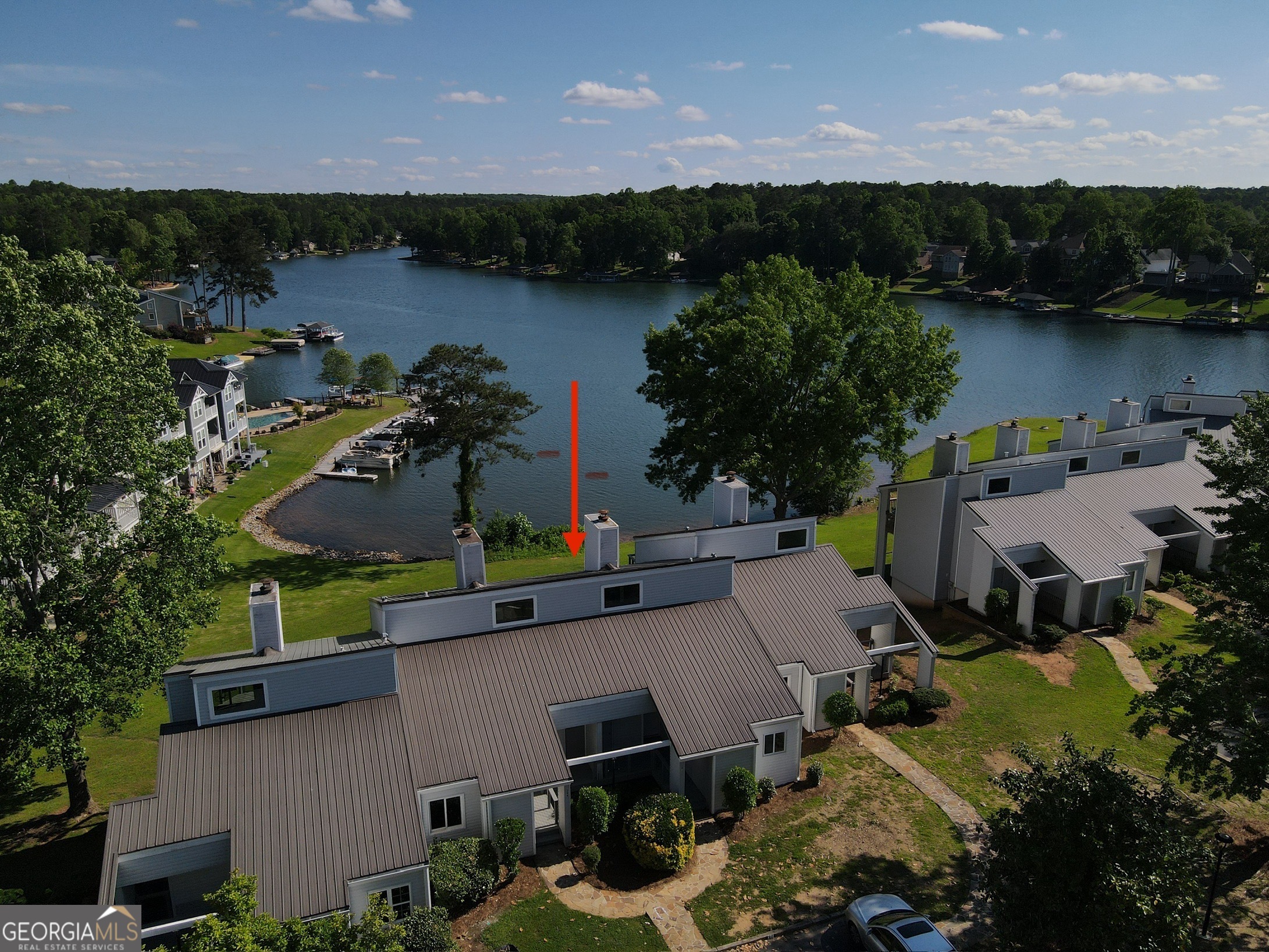 an aerial view of a house with lake view