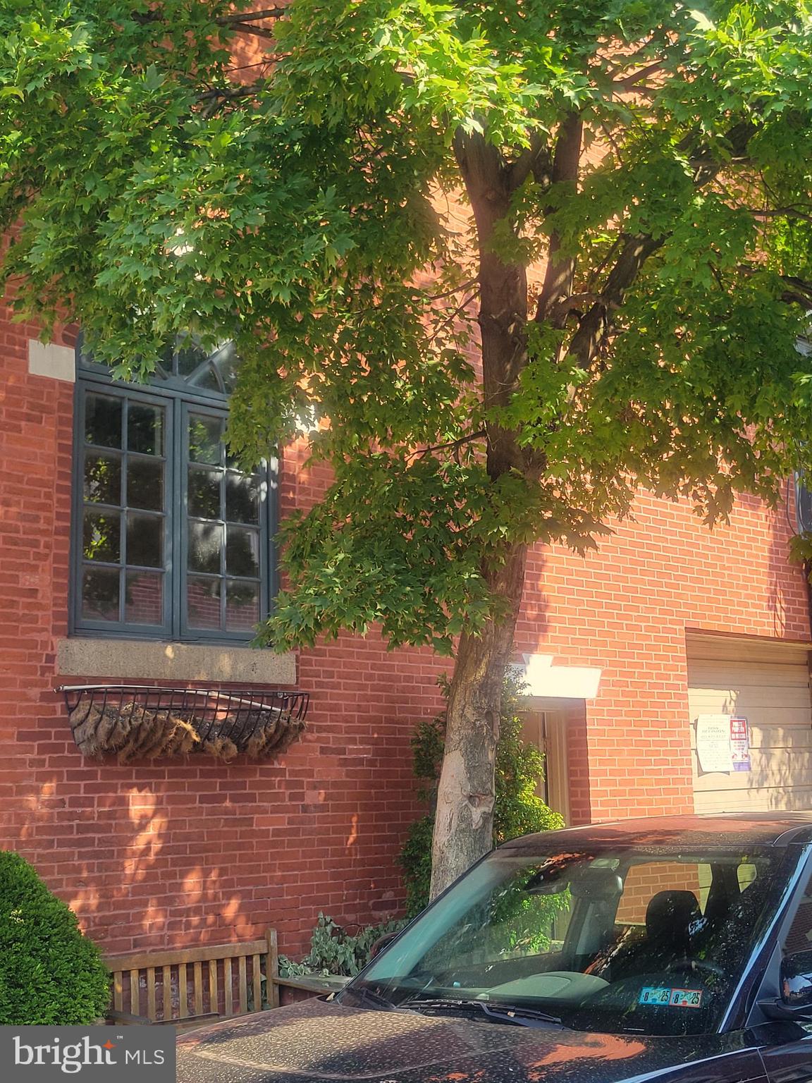 a view of a house with a tree