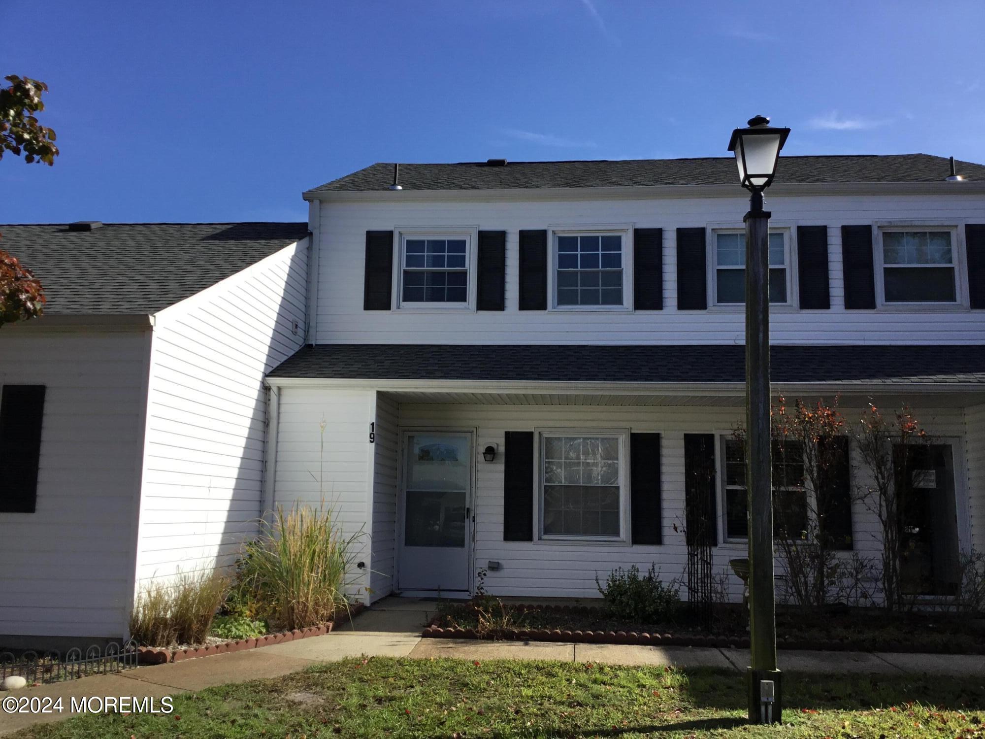 a front view of a house with yard