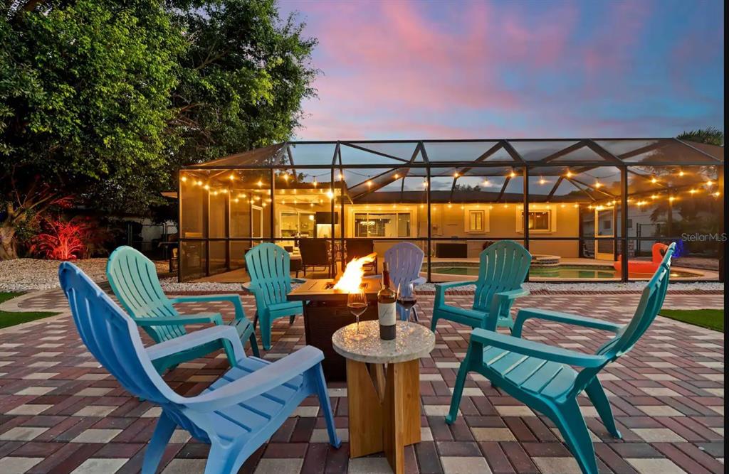 a view of a chairs and table in patio