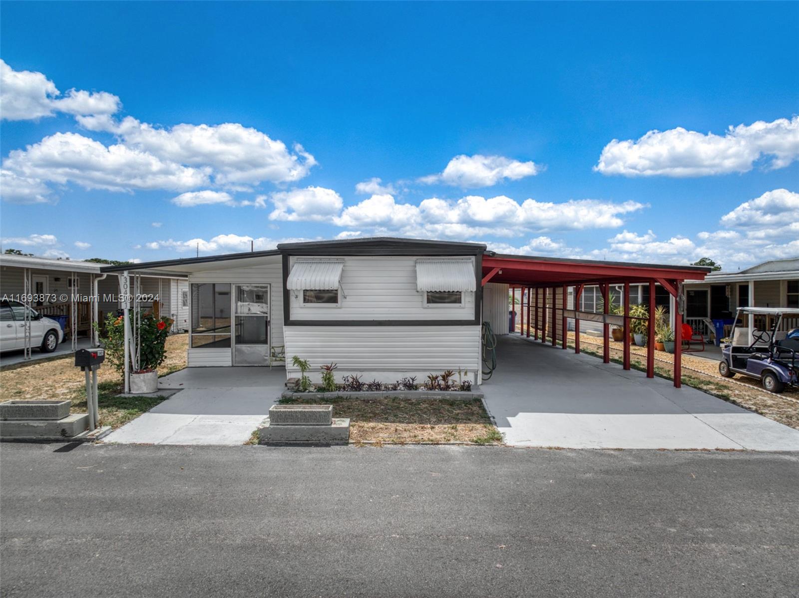 a view of a car park in front of house