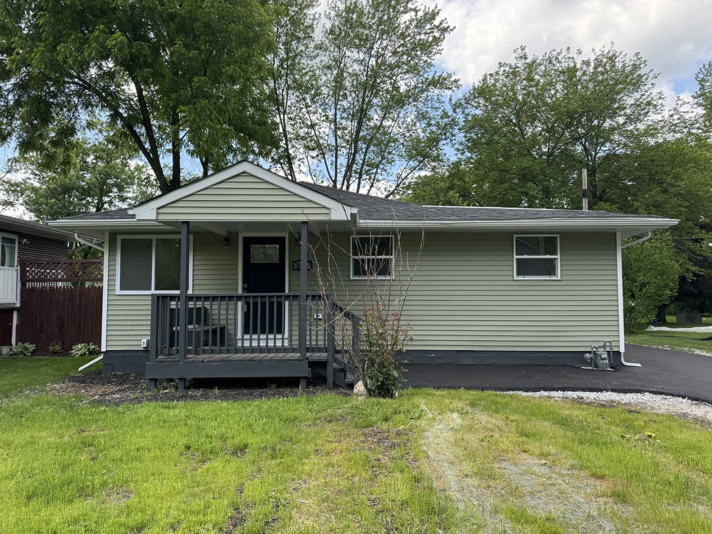 a front view of a house with yard