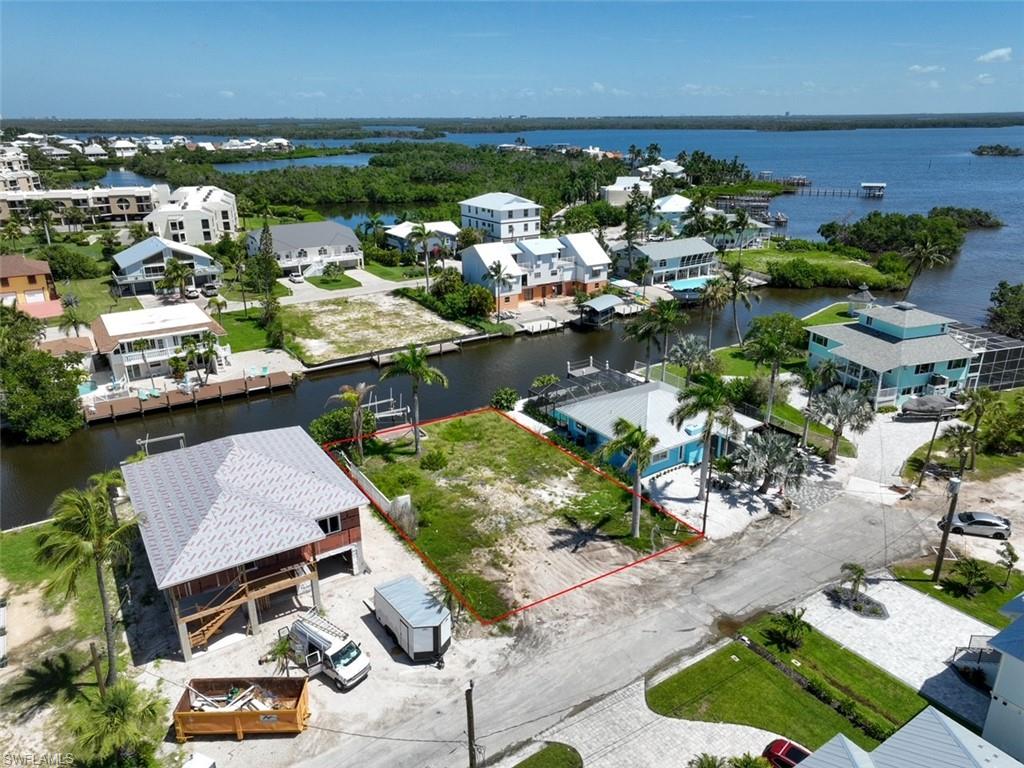 an aerial view of a house with a lake view