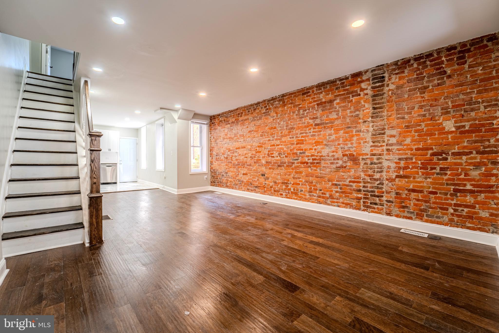 a view of entryway with wooden floor