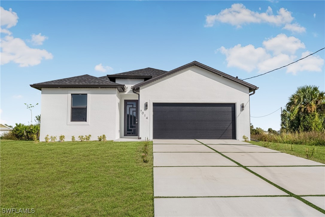 a front view of a house with yard