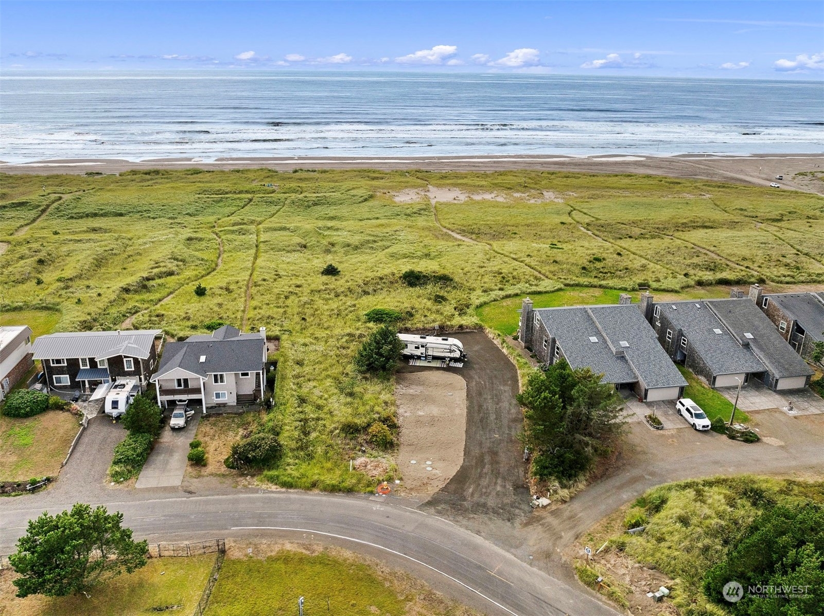 a view of an ocean and a houses