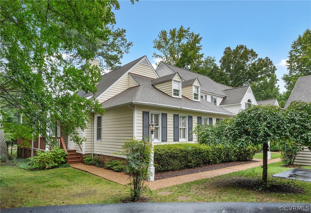 a house that has a tree in front of the house