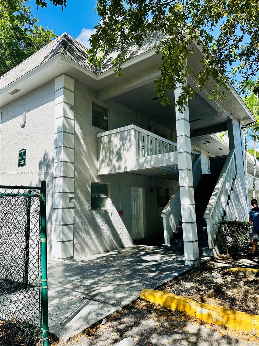 a view of a house with a small yard