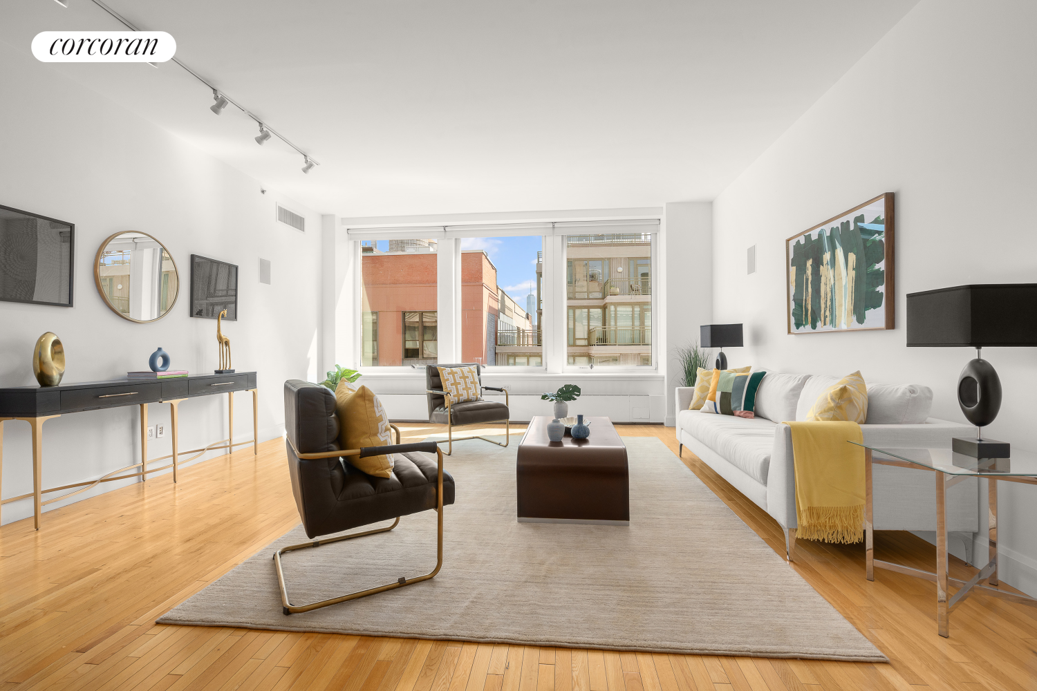 a living room with furniture rug and a large window