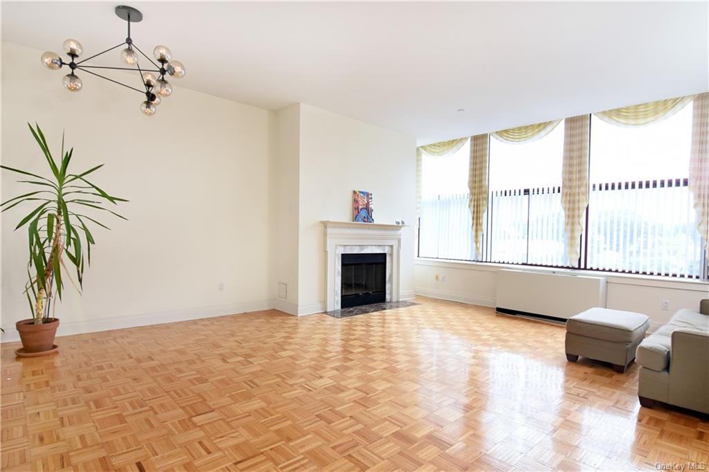 a view of livingroom with furniture fire place and windows