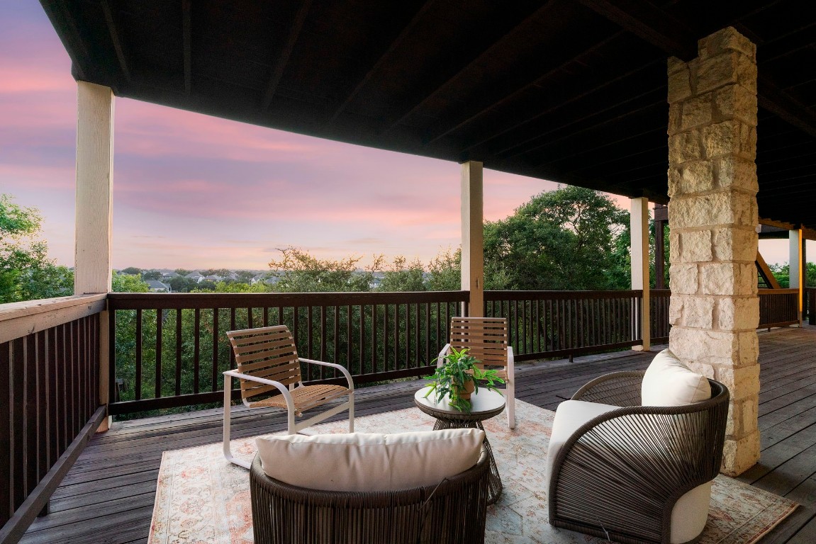 a view of a chairs in wooden deck