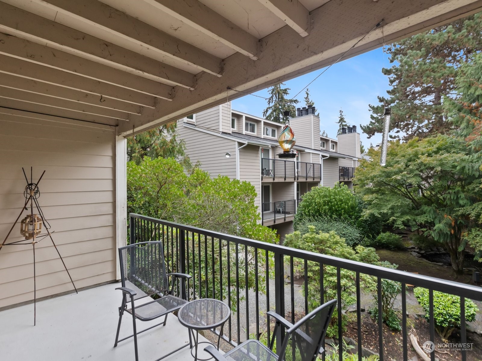 a view of a balcony with furniture