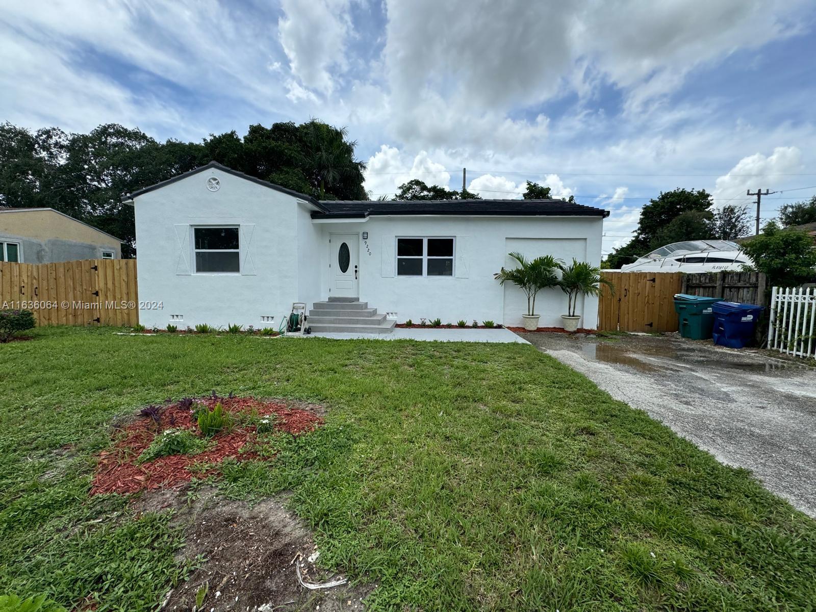 a house view with a garden space