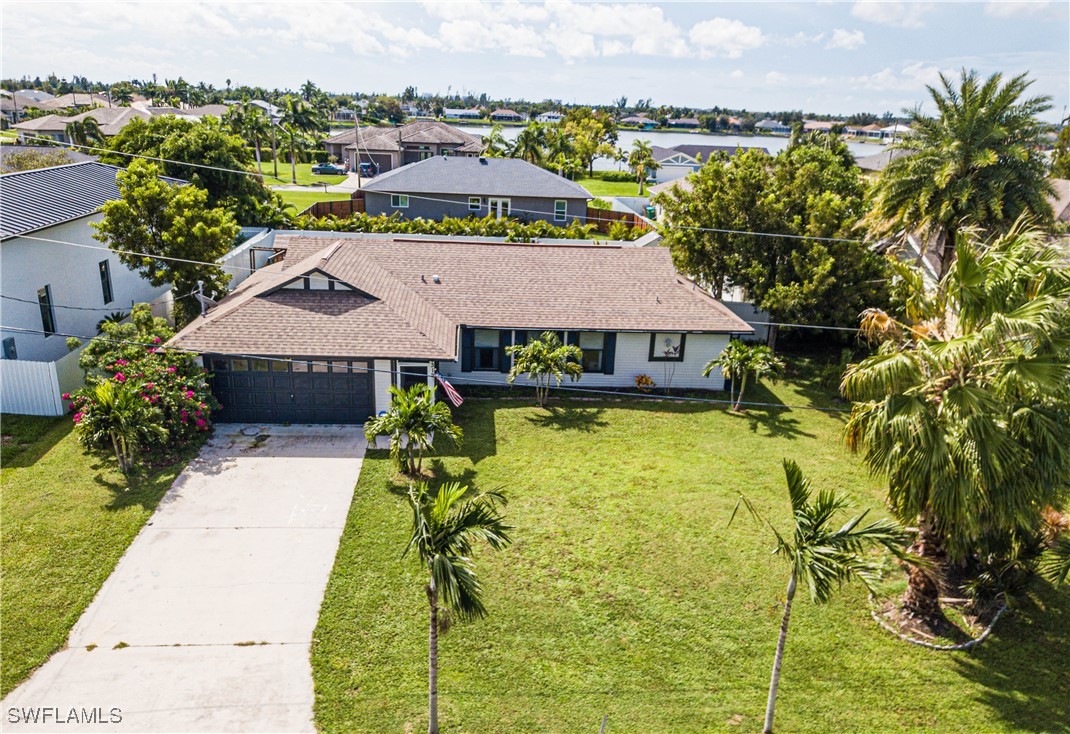 a aerial view of a house with swimming pool