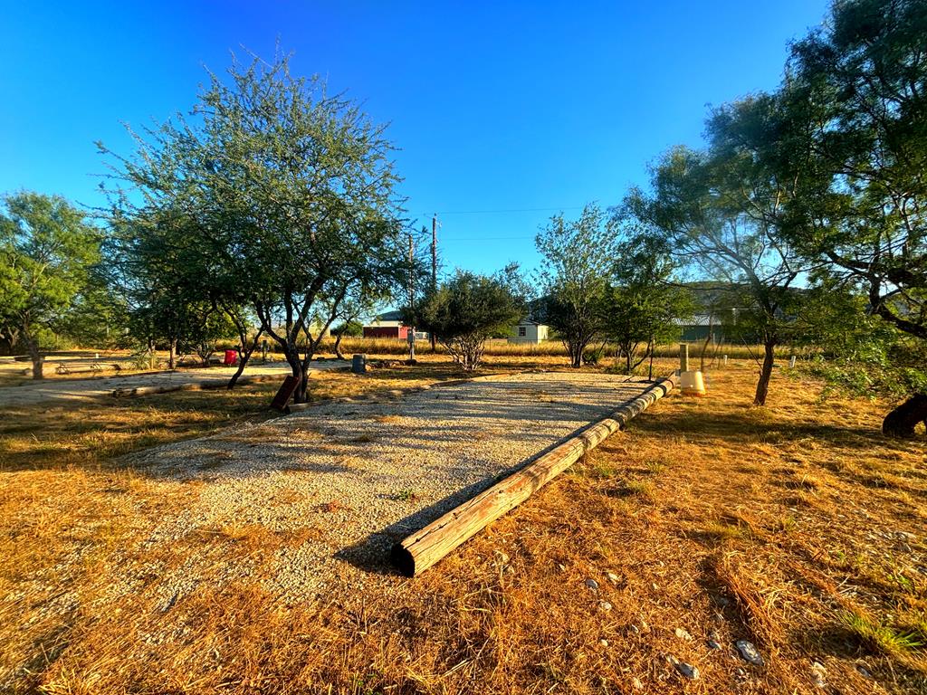 a view of a swimming pool with an outdoor seating