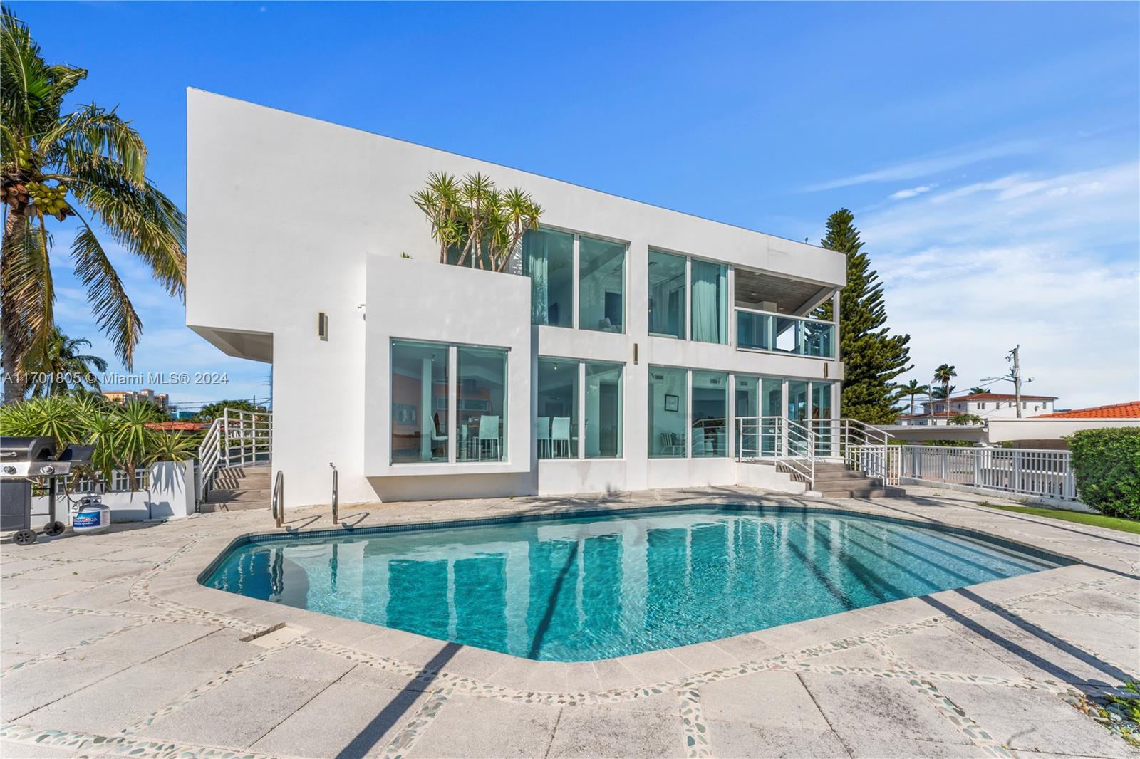 a view of a swimming pool with a lounge chairs