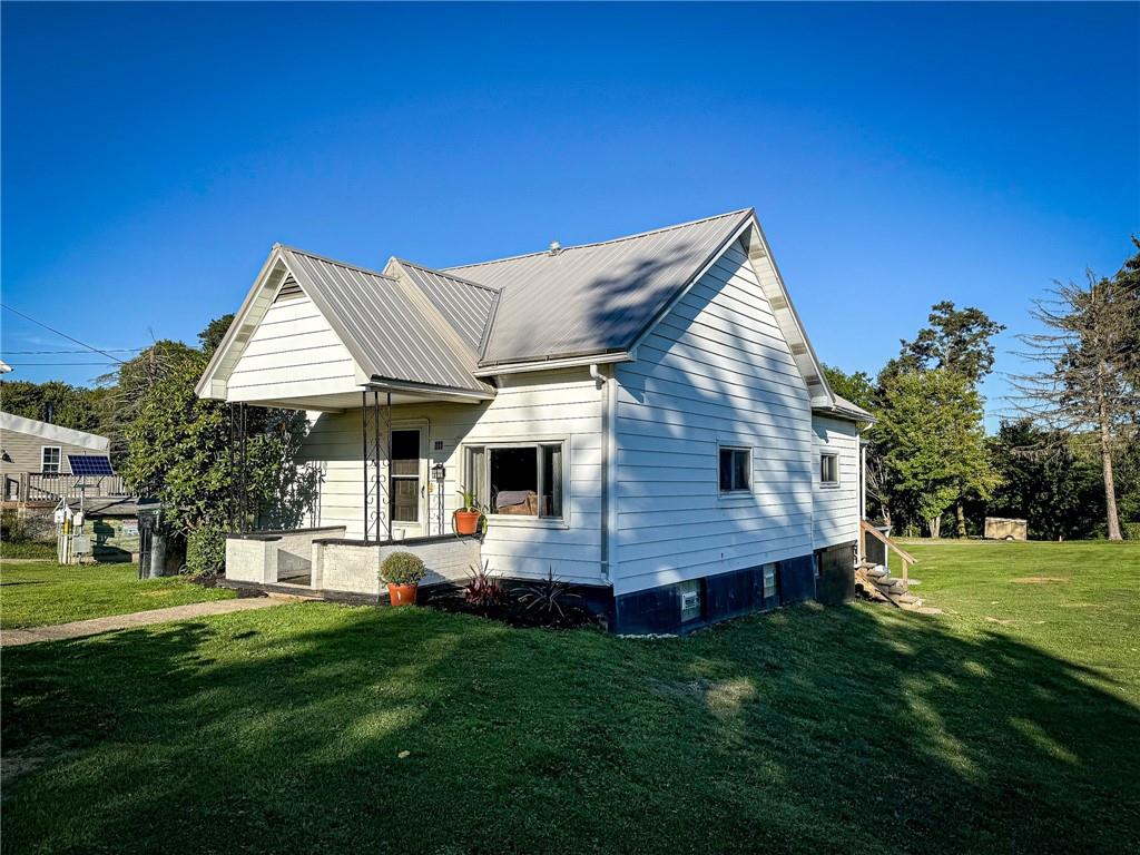 a front view of house with yard and green space